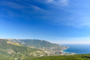 Fototapeta na wymiar view of the resort city of Yalta, on a bright sunny day with clouds in the sky.