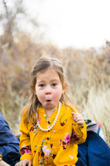 Young boy makes silly face at camera