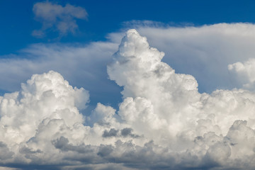 Naklejka na ściany i meble Cumulus clouds against the blue sky