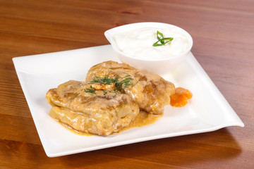 Homemade stuffed cabbage with cream