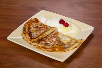 Pancakes with sour cream and condenced milk