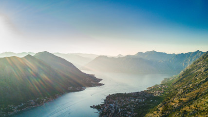 Fototapeta na wymiar Panoramic aerial view of the red tiled roofs of the old town of Kotor and Kotor Bay in Montenegro