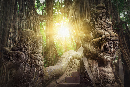 Ancient dragon sculptures on the bridge in monkey forest, Ubud, Bali, Indonesia