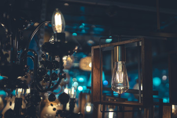 light  bulbs and chandeliers in the dark