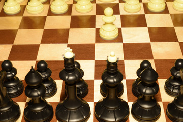Chechered board with the pawns as a game theme