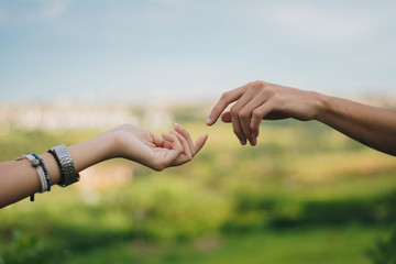 young couple holding hands