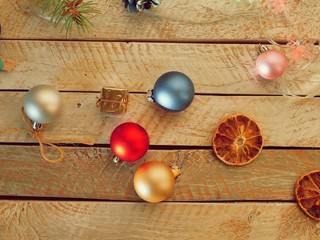 Decor, illuminated Christmas tree, Christmas toys and slices of dried lemon on a wooden table, seasonal winter holidays