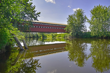 Fototapeta premium Prud'homme bridge seen from the river, Mont-Tremblant, Quebec, C