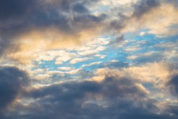 Fototapeta na wymiar Blue sky among dark clouds. Cloudy landscape