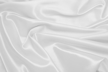 Obraz premium Smooth elegant white silk or satin luxury cloth texture as wedding background. Luxurious background design