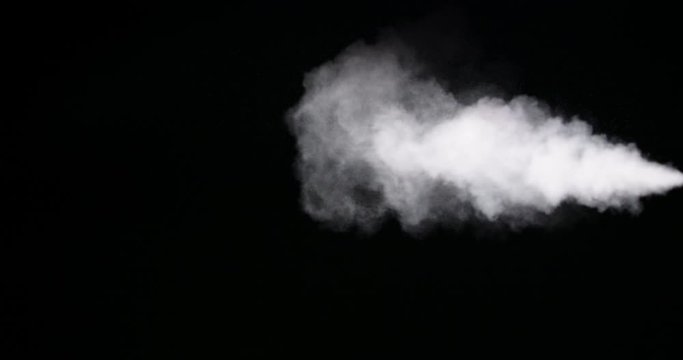 Spray of smoke on black background