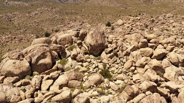 Aerial shot of interesting rock formations in the desert of California
