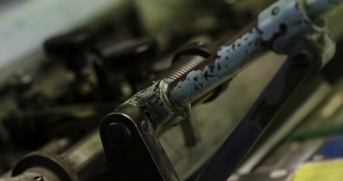 Footage of printing machine mechanisms.