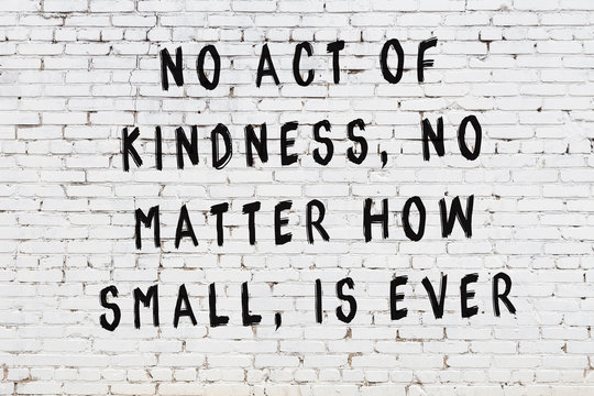 Painted black mindful inscription on white brick wall background