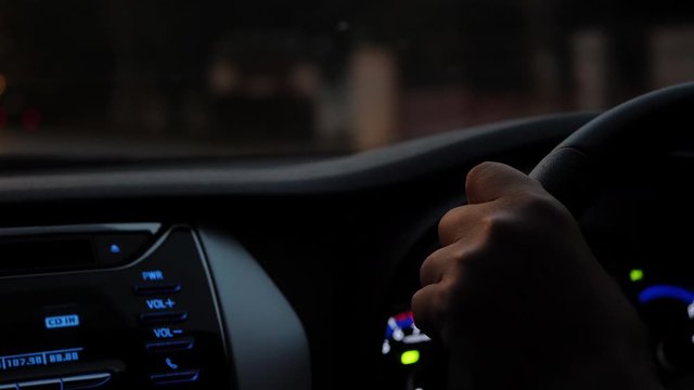 people driving car on night road city