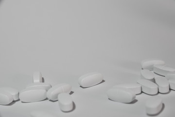 a lot of pills on white background,