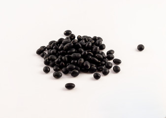 Fototapeta na wymiar group of dried black beans on white background