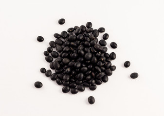 group of dried black beans on white background