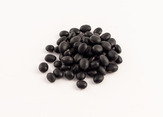group of dried black beans on white background