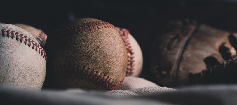 Horizontal baseball banner close up of old balls.