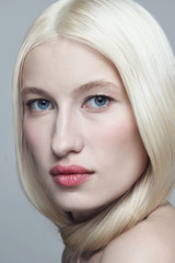 Naklejka premium Portrait of young beautiful blonde woman with clean makeup