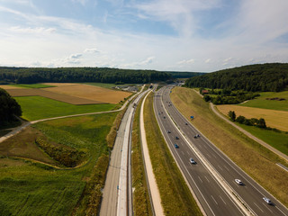Fototapeta na wymiar Aerial view of Highway A8 on the swabian alp between Ulm and Merklingen with construction works of the Stuttgart21 railway project