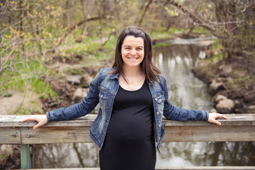 beautiful portrait of pregnant woman in nature