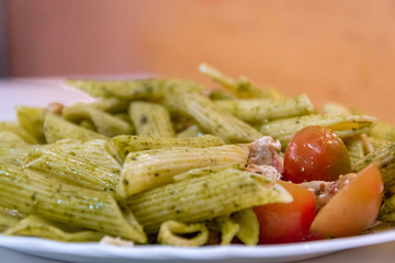  Delicious fresh pasta meal with pesto sauce, fresh tomatoes and cheese