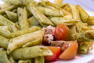  Delicious fresh pasta meal with pesto sauce, fresh tomatoes and cheese