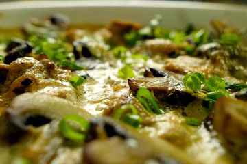 Fried chicken with mushrooms, milk and onions.