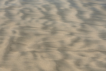 Two color sand beach due to undertow. Geometric abstract pattern left by ocean tide
