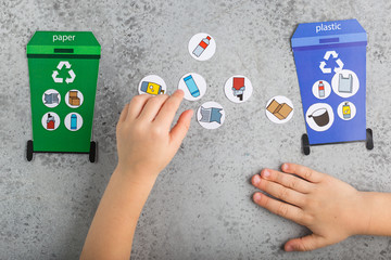 Recycling game design for children girl hands ecology education waste recycling concept