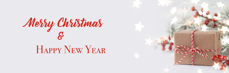 Christmas gift box and red holly berries