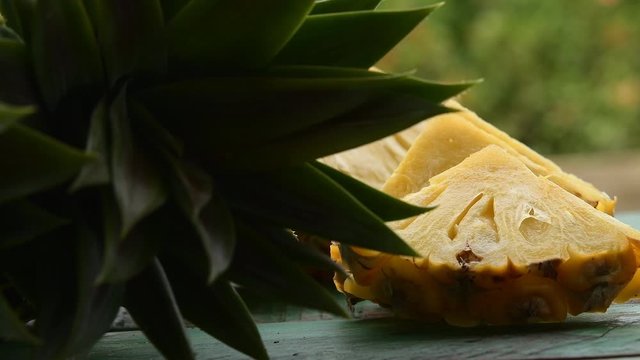Slices Of Pineapple On Green Wood