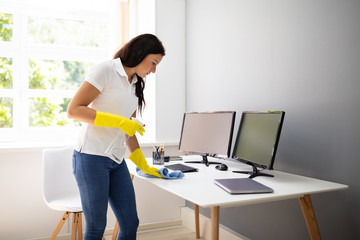 Janitor Cleaning Desk With Napkin