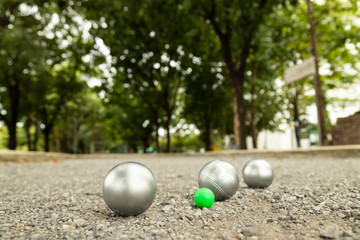 Petanque balls in the playing field.