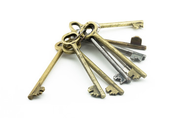 Antique vintage bunch of keys macro on white background