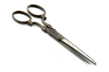 Antique scissors on white background