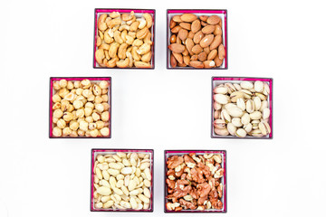Different types of nuts: peanuts, cashews, almonds, hazelnuts, walnuts and pistachios, horizontal orientation, copy space, top view