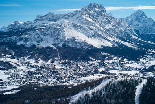 The Romantic, Snow Covered Skiing Resort of Cortina d Ampezzo in the Italian Dolomites seen from Tofana with Col Druscie in the foreground.
