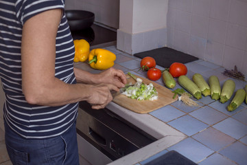aged woman hands in process of cooking vegetables step by step recipe ratatouille natural light