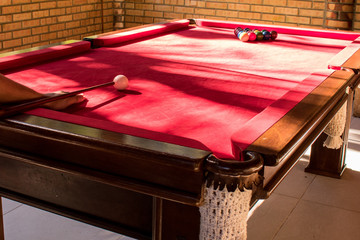 billiard balls on table in game room