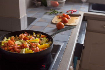 Cut vegetables process cooking for concept design yellow pepper and tomatoes