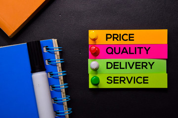 Price, Quality, Delivery, Service text on sticky notes isolated on Black desk. Mechanism Strategy Concept
