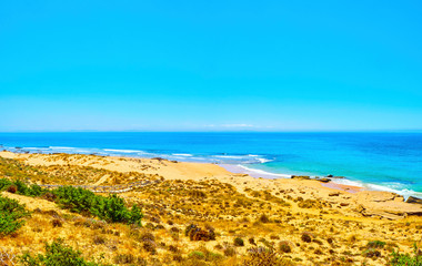 Panoramic view of The Faro de Trafalgar Beach, a broad beach of fine sand dunes of The Cabo de...