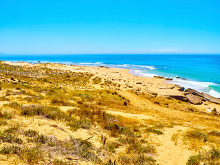 Faro de Trafalgar Beach, a broad beach of fine sand dunes of The Cabo de Trafalgar Cape Natural...