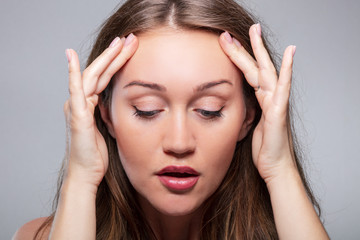 Fototapeta premium Woman Doing Face Fitness Exercises