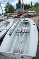 Boat yard with small sailing boats and kayaks