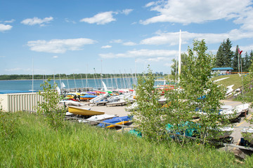 Fototapeta na wymiar View of boat yard with small sailing boats and kayaks