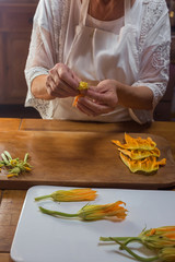 step by step process of cooking courgette flower Provence dish hands